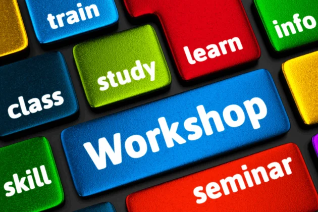 Ausschnitt aus einer Tastatur, auf der die Tasten englisch beschriftet sind mit z. B. train, study, Workshop ...